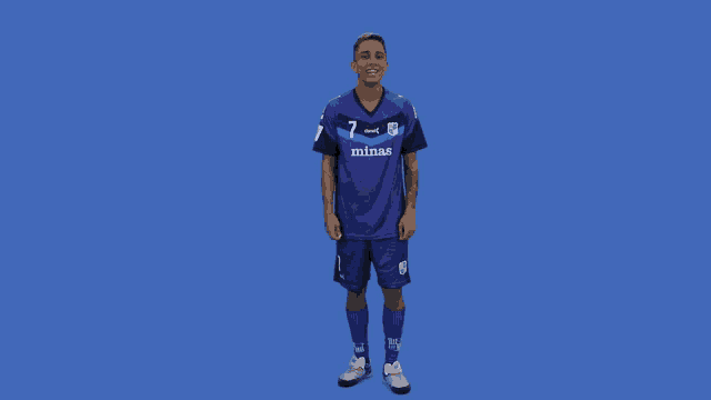 a soccer player wearing a purple jersey that says minas on it