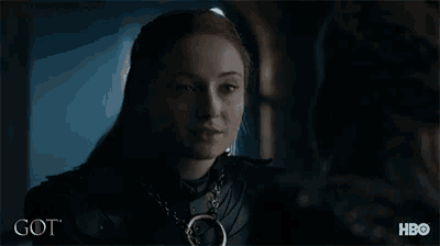 a woman in a knight 's armor is smiling in a got advertisement