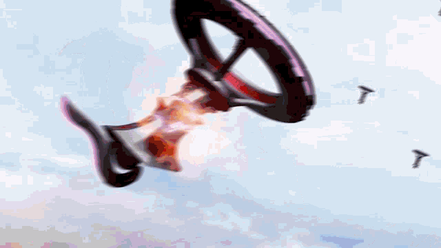 a blurred image of a person standing in front of a large fire