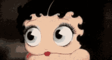 a close up of betty boop 's face with big eyes and a red lip .