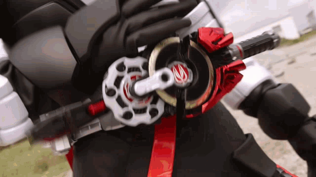 a close up of a person 's belt with a red ribbon
