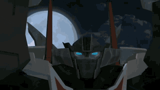 a close up of a robot with blue eyes and a red background