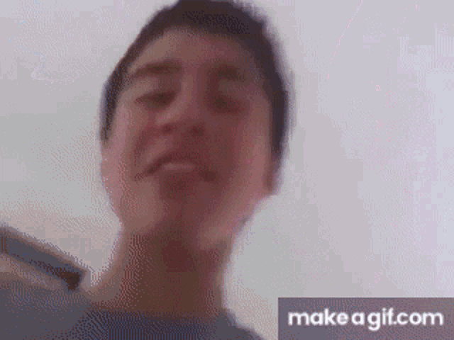 a close up of a person 's face with the words make a gif.com below