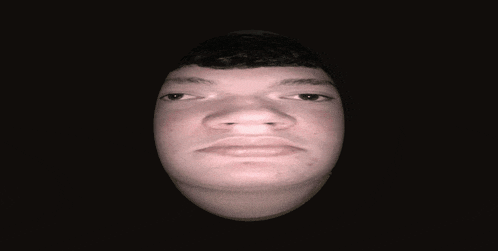a close up of a man 's face with a black background
