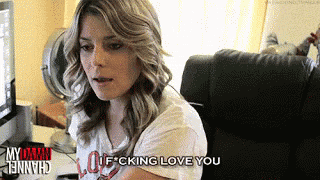 a woman is sitting in front of a computer and saying " i f cking love you "