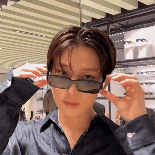 a man wearing sunglasses is looking at the camera
