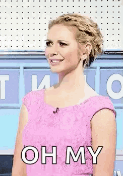 a woman in a pink dress with the words oh my on her chest