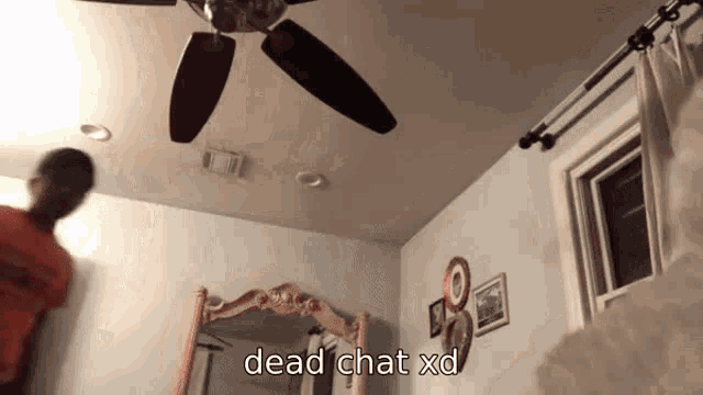 a room with a ceiling fan and the words dead chat xd written on the bottom