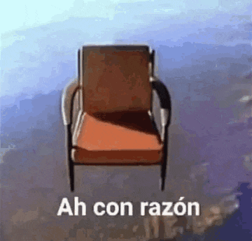 a chair is flying through the air with the words `` ah con razon '' written on it .