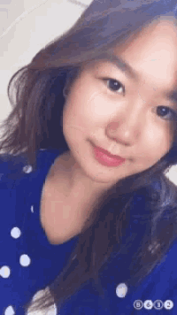 a close up of a woman 's face with the numbers b612 visible