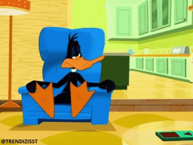 a cartoon of a duck sitting in a chair
