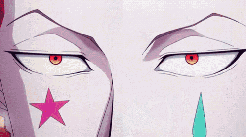 a close up of a person 's face with a pink star on it and a tear coming out of his nose .