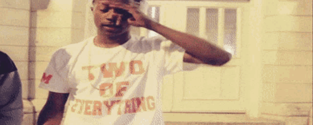 a man wearing a t-shirt that says " two of everything "