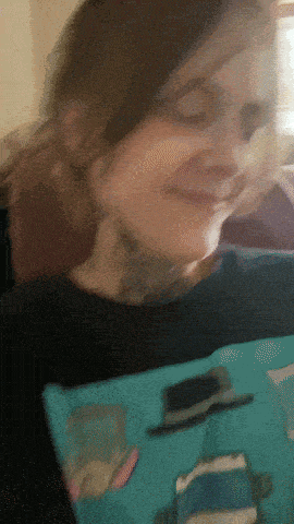 a blurry picture of a woman wearing a black shirt