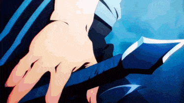 a close up of a person holding a sword in their hand .