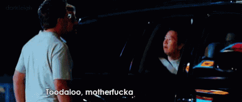 two men are standing in front of a car and one of them is saying toodaloo motherfuckaa