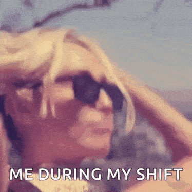 a woman wearing sunglasses is holding her hair and says me during my shift