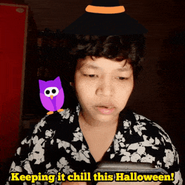 a person with a purple owl and a witch hat on their head says keeping it chill this halloween