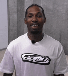 a man wearing a white t-shirt that says gdm on it
