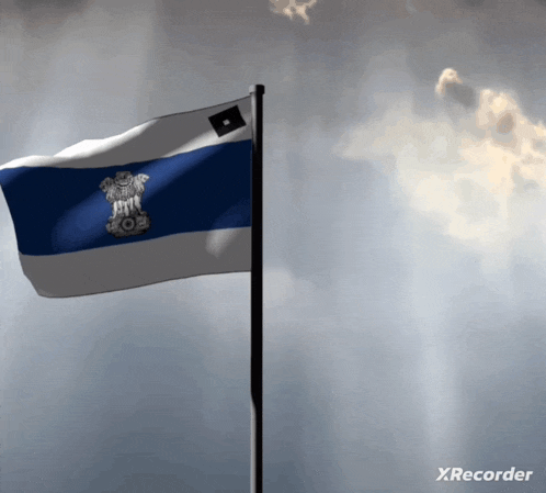a blue and white flag is flying in front of a cloudy sky and the word xrecorder is on the bottom right