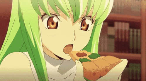 a girl with green hair is eating a piece of pizza .