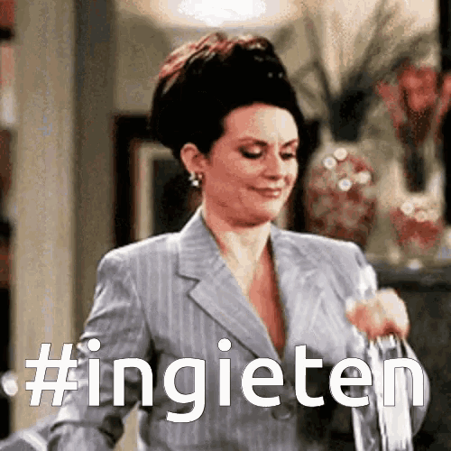 a woman in a suit is holding a purse and the word ingieten is on the bottom