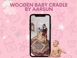 a picture of a wooden baby cradle by aarsun on a pink background