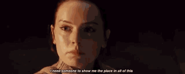 a close up of a woman 's face with the words `` i need someone to show me the place in all of this ''