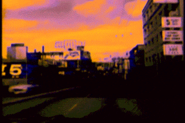 a blurred image of a city with a sign that says c6