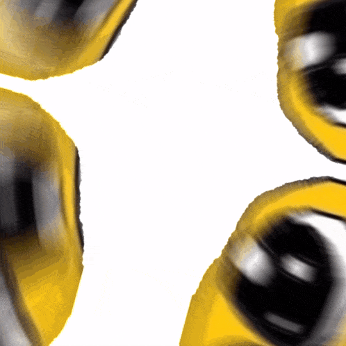 three yellow and black balls are floating in the air
