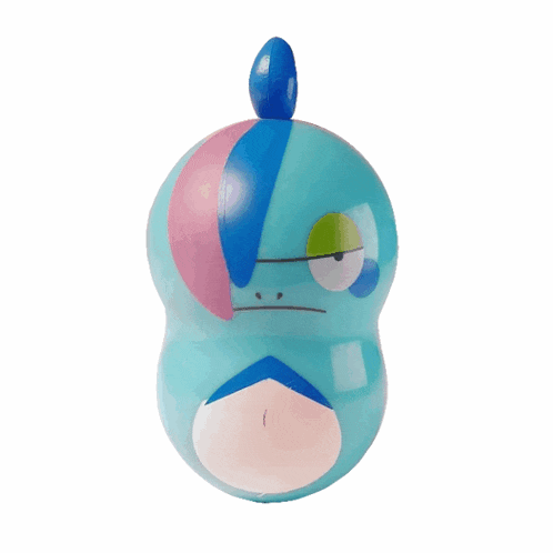 a blue toy with a pink and blue face on a white background