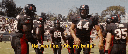 a football player with the number 44 on his jersey stands on the field