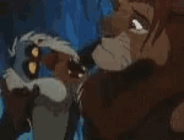 a lion and a monkey are standing next to each other .
