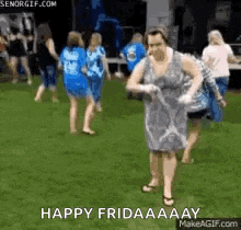 a woman in a dress is dancing in the grass with a group of women .