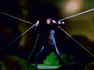 a man is holding a sword in front of a green background with chinese characters