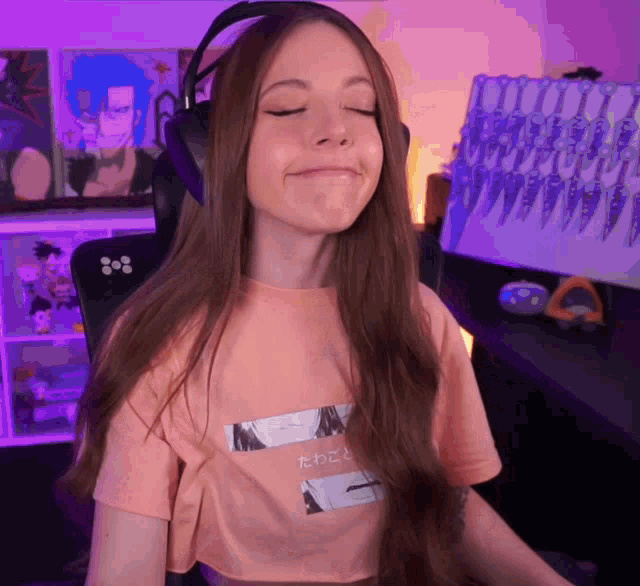 a woman wearing headphones and a t-shirt with a picture of a woman on it