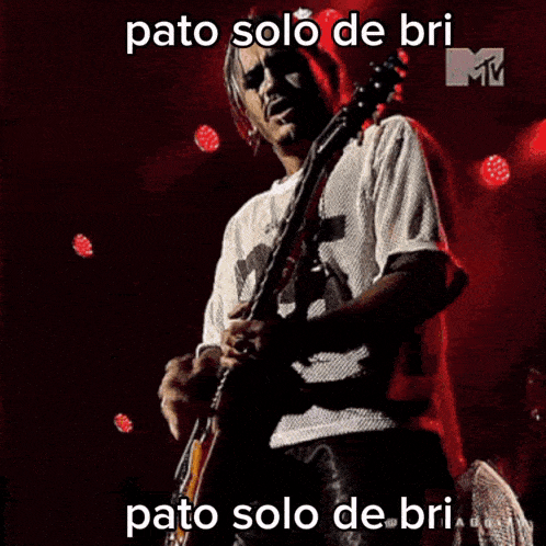 a man playing a guitar with the words pato solo de bri written above him