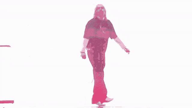 a man in a black shirt is dancing on stage