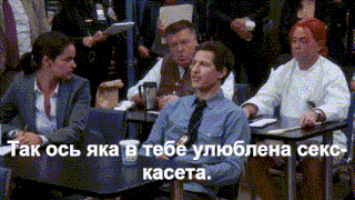 a man in a tie sits in a classroom with other people and says tak osy jka