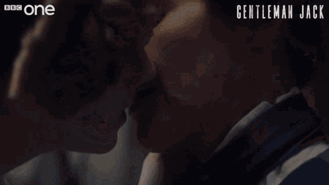 a close up of a man and woman kissing with gentleman jack written on the bottom