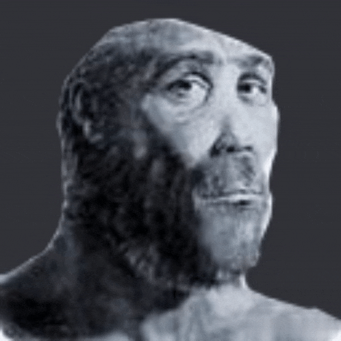 a black and white photo of a man with a beard looking at the camera .