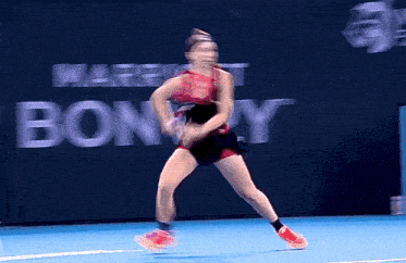 a blurred image of a tennis player in front of a marriott bonny sign