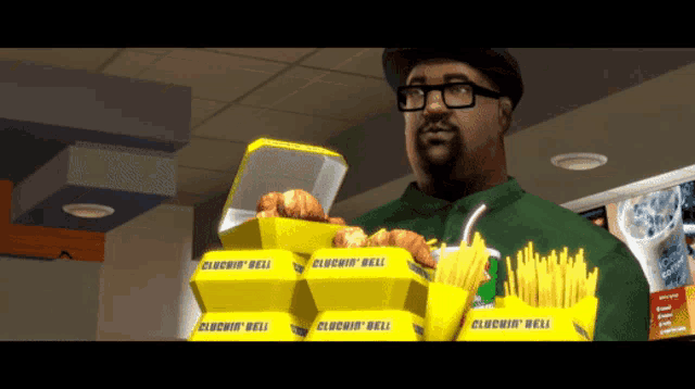 a man in a green shirt is holding a stack of cluchin ' bell boxes and french fries