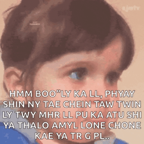 a little girl with a caption that says hmm boo ' ly ka ll phyay