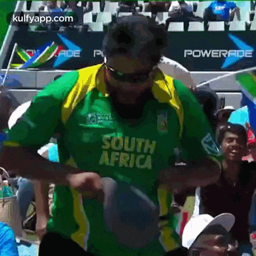 a man in a south africa jersey is dancing