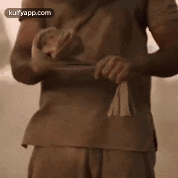 a close up of a person 's hand holding a stick in the dark .