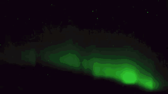 the aurora borealis is glowing brightly in the night sky