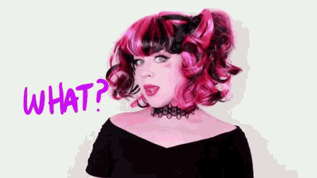 a woman with pink and black hair is wearing a choker and a wig and is asking what .
