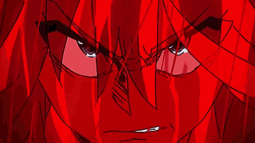 a close up of a person 's face with red hair
