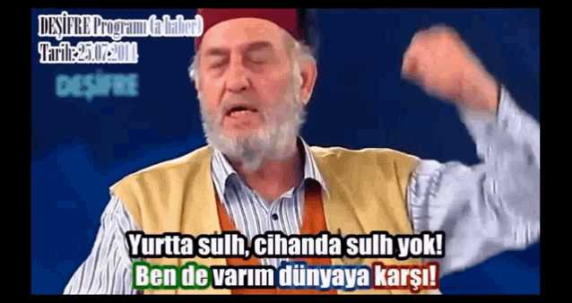 a man with a beard is making a funny face and says " ben de varim dünyaya karsi "